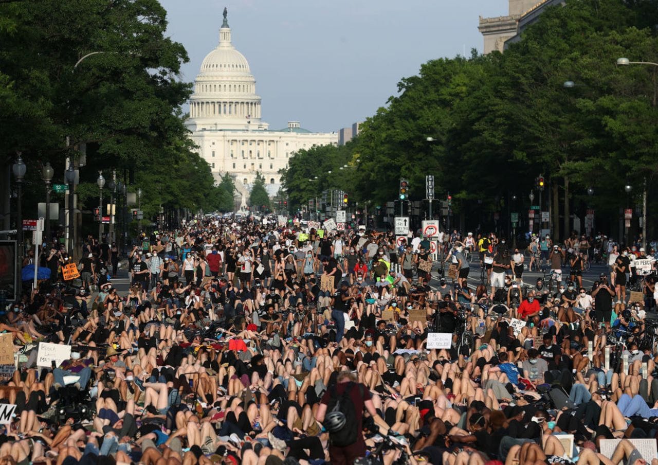 Protestors in the street with US capitol in background